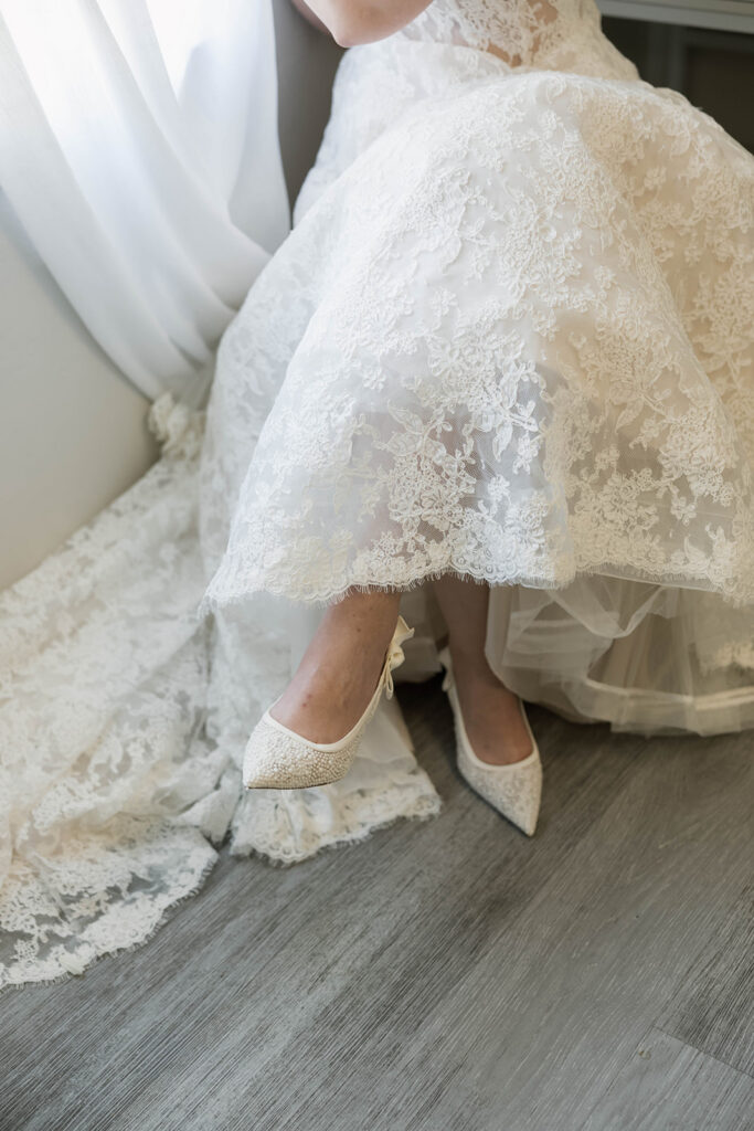 Romantic wedding scene featuring soft pastel florals, elegant decor, emotional couple moments, and guests celebrating in a light-filled venue inspired by Monet’s water lily paintings.