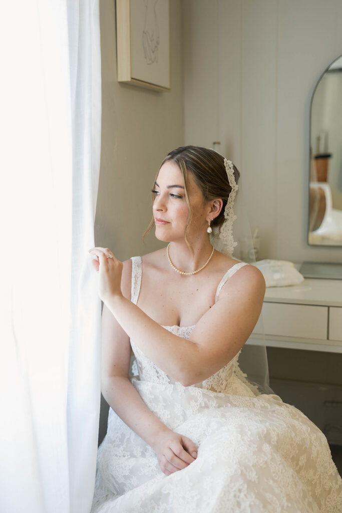 Romantic wedding scene featuring soft pastel florals, elegant decor, emotional couple moments, and guests celebrating in a light-filled venue inspired by Monet’s water lily paintings.