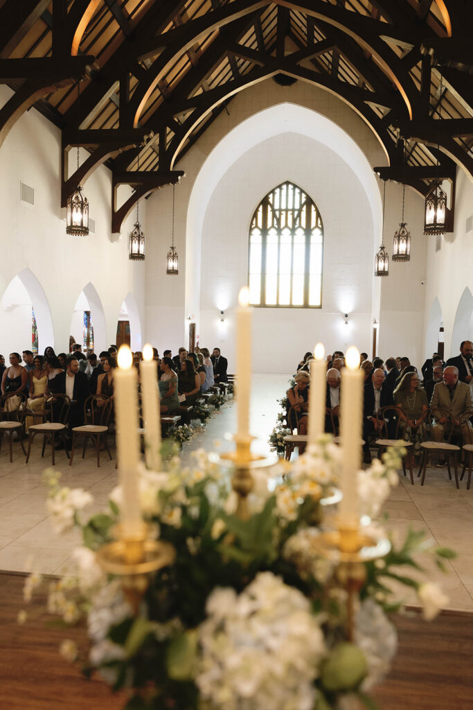 Romantic wedding scene featuring soft pastel florals, elegant decor, emotional couple moments, and guests celebrating in a light-filled venue inspired by Monet’s water lily paintings.