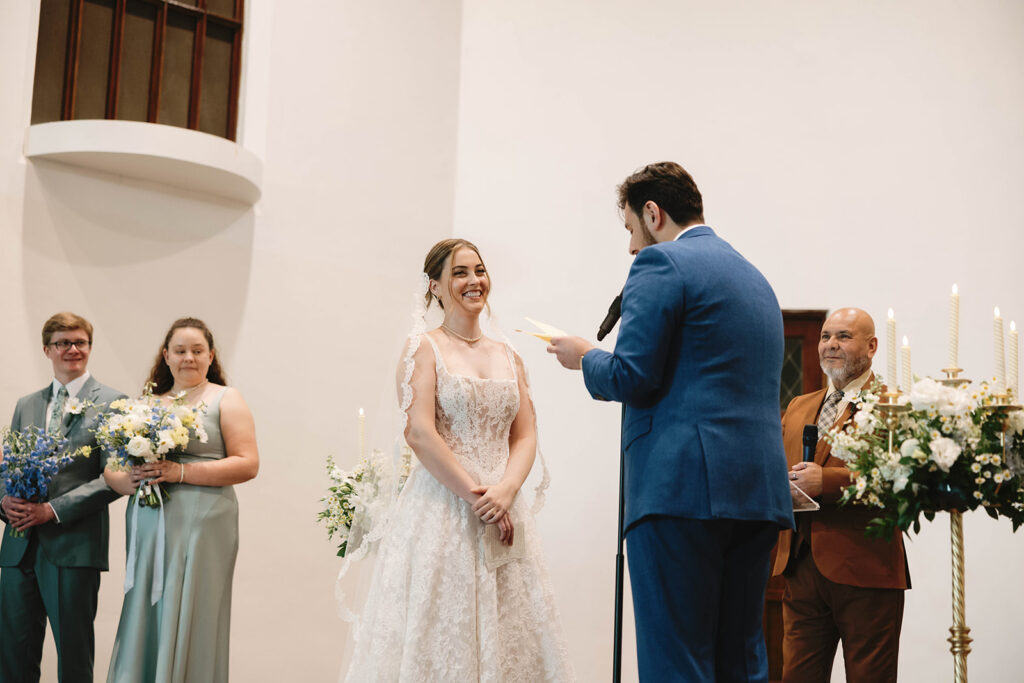Romantic wedding scene featuring soft pastel florals, elegant decor, emotional couple moments, and guests celebrating in a light-filled venue inspired by Monet’s water lily paintings.