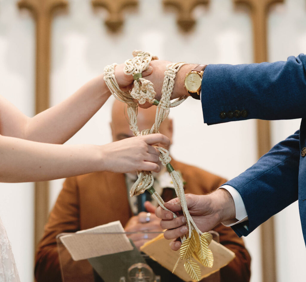 Romantic wedding scene featuring soft pastel florals, elegant decor, emotional couple moments, and guests celebrating in a light-filled venue inspired by Monet’s water lily paintings.