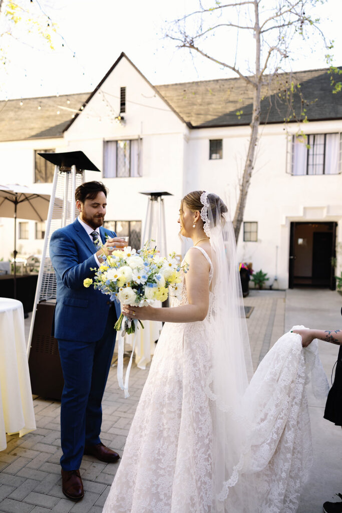 Romantic wedding scene featuring soft pastel florals, elegant decor, emotional couple moments, and guests celebrating in a light-filled venue inspired by Monet’s water lily paintings.