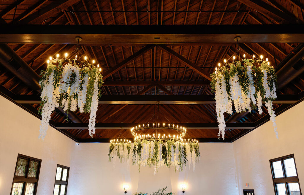 Romantic wedding scene featuring soft pastel florals, elegant decor, emotional couple moments, and guests celebrating in a light-filled venue inspired by Monet’s water lily paintings.