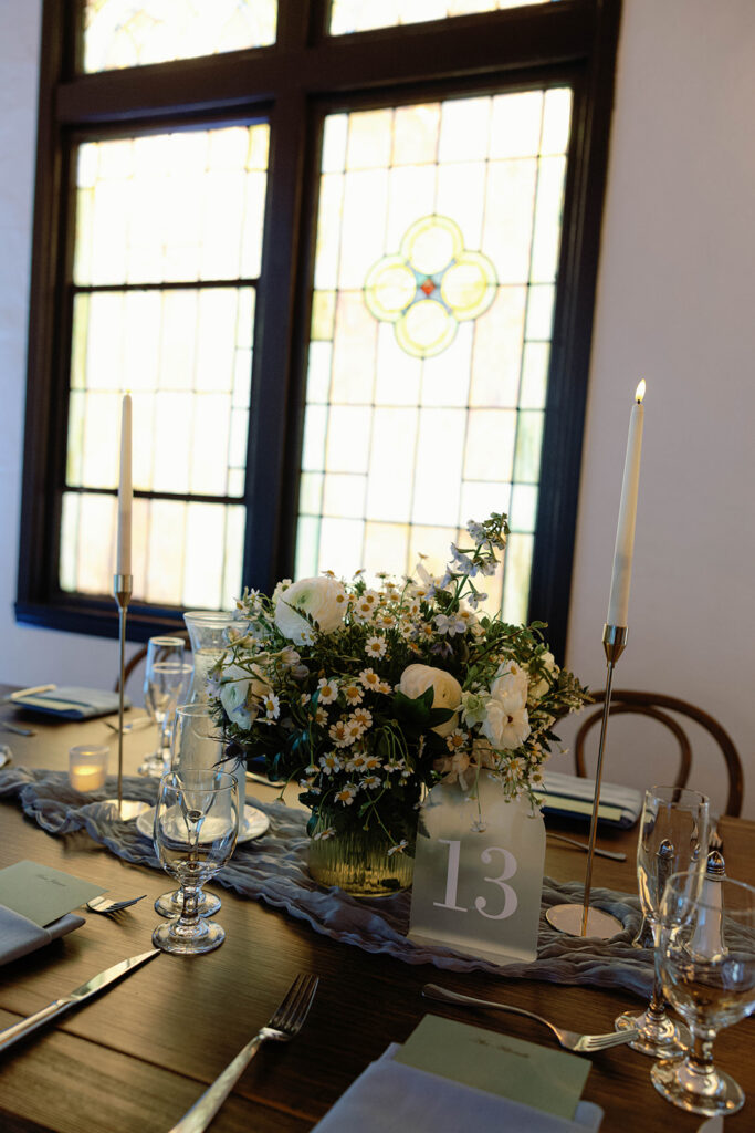 Romantic wedding scene featuring soft pastel florals, elegant decor, emotional couple moments, and guests celebrating in a light-filled venue inspired by Monet’s water lily paintings.