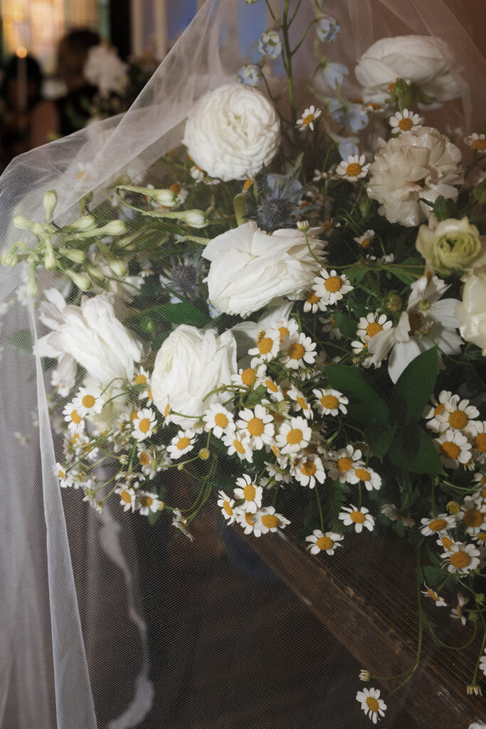 Romantic wedding scene featuring soft pastel florals, elegant decor, emotional couple moments, and guests celebrating in a light-filled venue inspired by Monet’s water lily paintings.