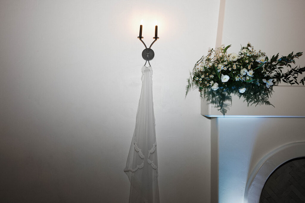 Romantic wedding scene featuring soft pastel florals, elegant decor, emotional couple moments, and guests celebrating in a light-filled venue inspired by Monet’s water lily paintings.