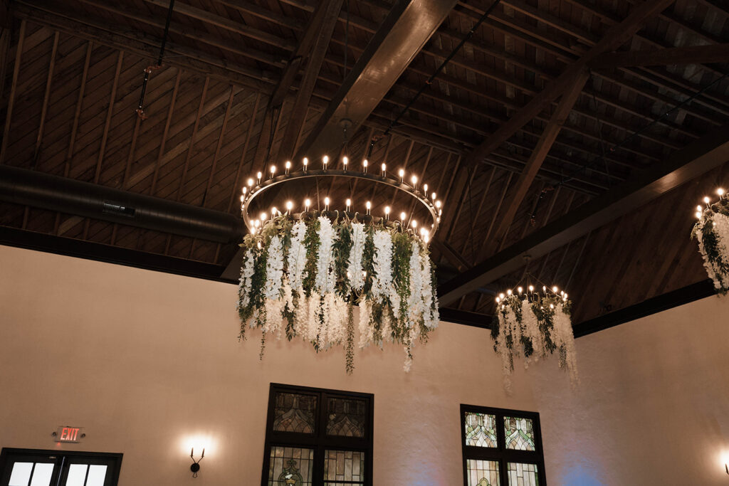 Romantic wedding scene featuring soft pastel florals, elegant decor, emotional couple moments, and guests celebrating in a light-filled venue inspired by Monet’s water lily paintings.