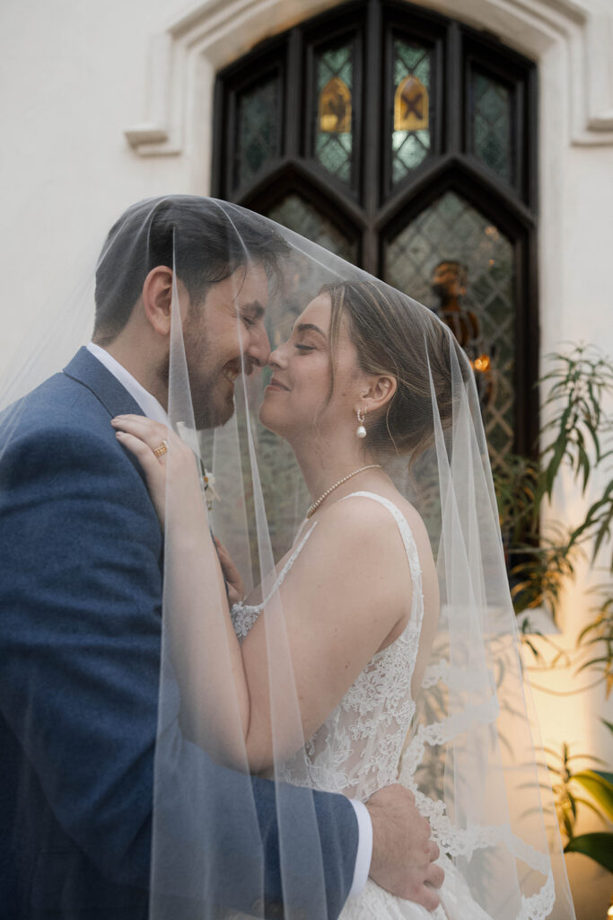 Romantic wedding scene featuring soft pastel florals, elegant decor, emotional couple moments, and guests celebrating in a light-filled venue inspired by Monet’s water lily paintings.