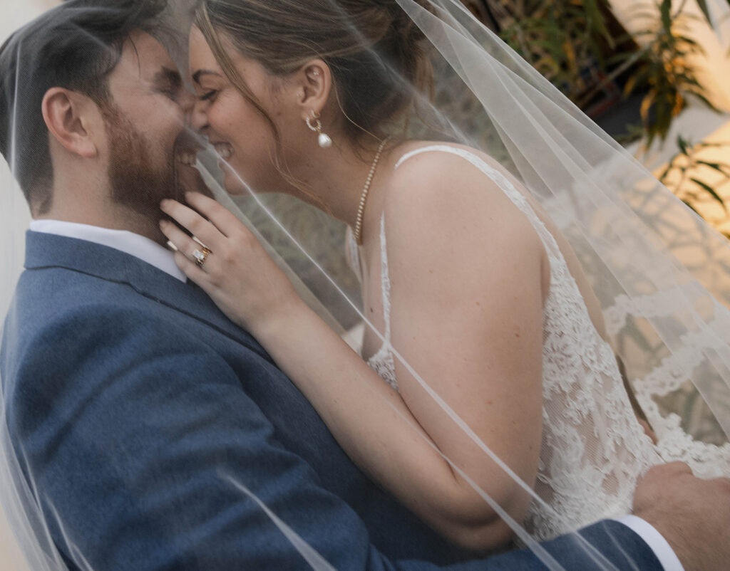 Romantic wedding scene featuring soft pastel florals, elegant decor, emotional couple moments, and guests celebrating in a light-filled venue inspired by Monet’s water lily paintings.