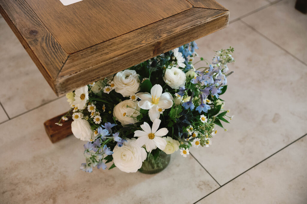 Romantic wedding scene featuring soft pastel florals, elegant decor, emotional couple moments, and guests celebrating in a light-filled venue inspired by Monet’s water lily paintings.