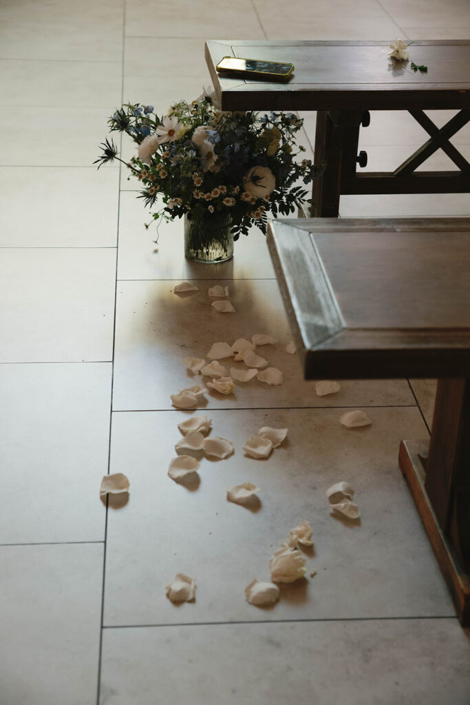 Romantic wedding scene featuring soft pastel florals, elegant decor, emotional couple moments, and guests celebrating in a light-filled venue inspired by Monet’s water lily paintings.