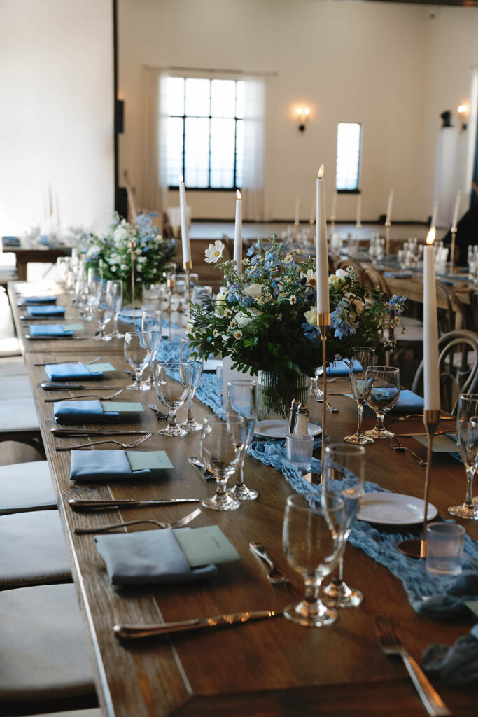 Romantic wedding scene featuring soft pastel florals, elegant decor, emotional couple moments, and guests celebrating in a light-filled venue inspired by Monet’s water lily paintings.
