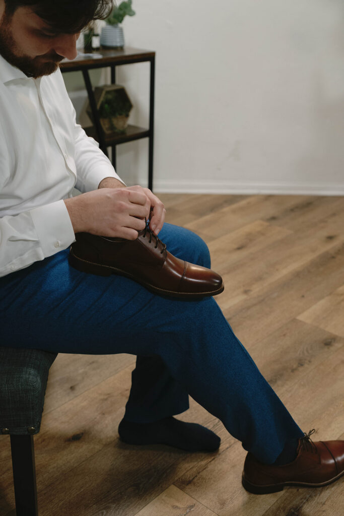 Romantic wedding scene featuring soft pastel florals, elegant decor, emotional couple moments, and guests celebrating in a light-filled venue inspired by Monet’s water lily paintings.