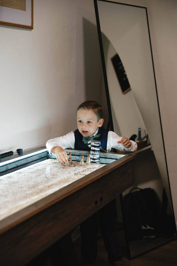 Romantic wedding scene featuring soft pastel florals, elegant decor, emotional couple moments, and guests celebrating in a light-filled venue inspired by Monet’s water lily paintings.