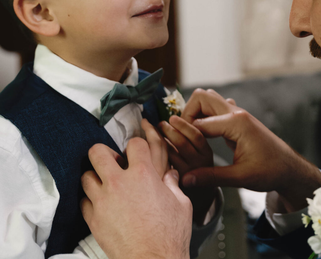 Romantic wedding scene featuring soft pastel florals, elegant decor, emotional couple moments, and guests celebrating in a light-filled venue inspired by Monet’s water lily paintings.