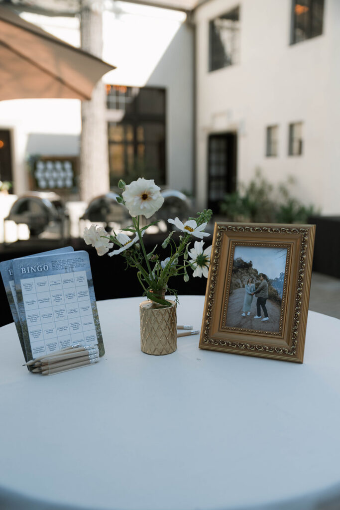 Romantic wedding scene featuring soft pastel florals, elegant decor, emotional couple moments, and guests celebrating in a light-filled venue inspired by Monet’s water lily paintings.