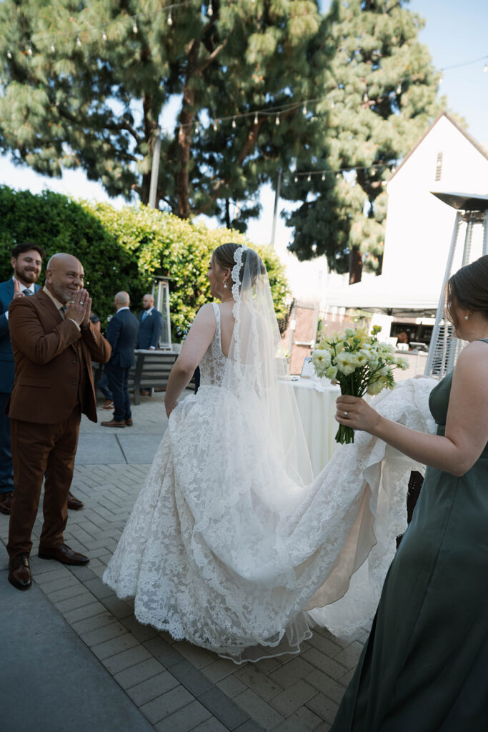 Romantic wedding scene featuring soft pastel florals, elegant decor, emotional couple moments, and guests celebrating in a light-filled venue inspired by Monet’s water lily paintings.