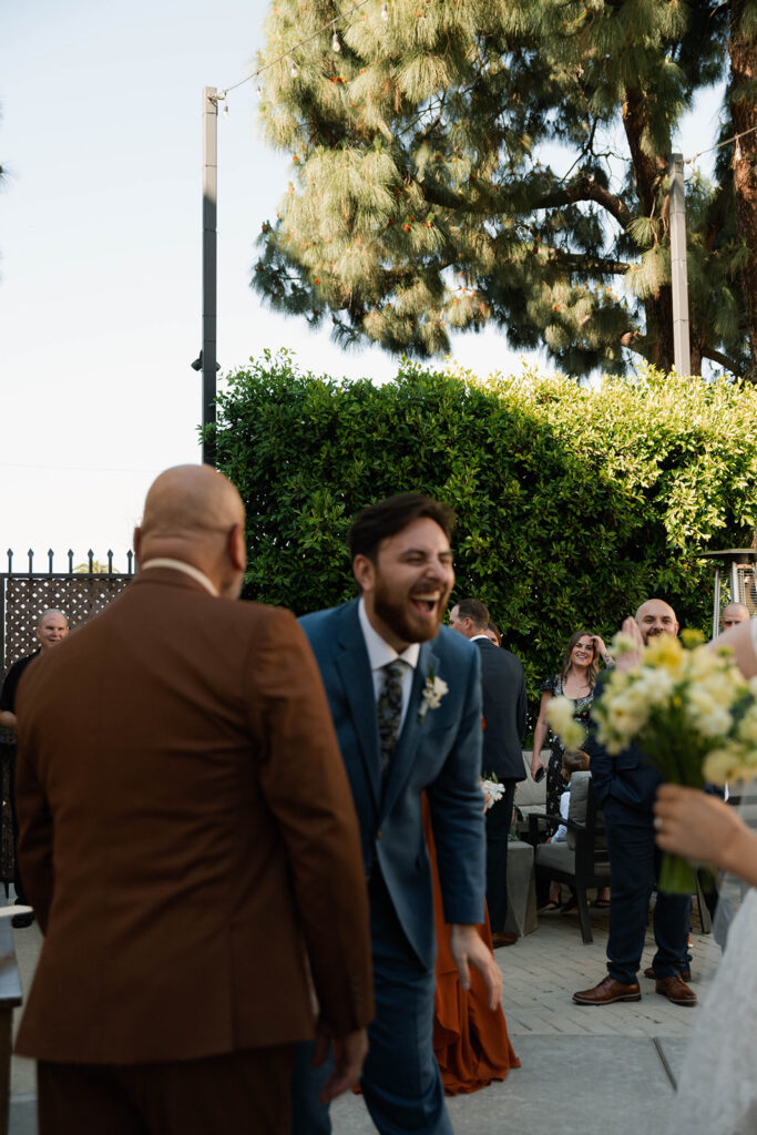 Romantic wedding scene featuring soft pastel florals, elegant decor, emotional couple moments, and guests celebrating in a light-filled venue inspired by Monet’s water lily paintings.