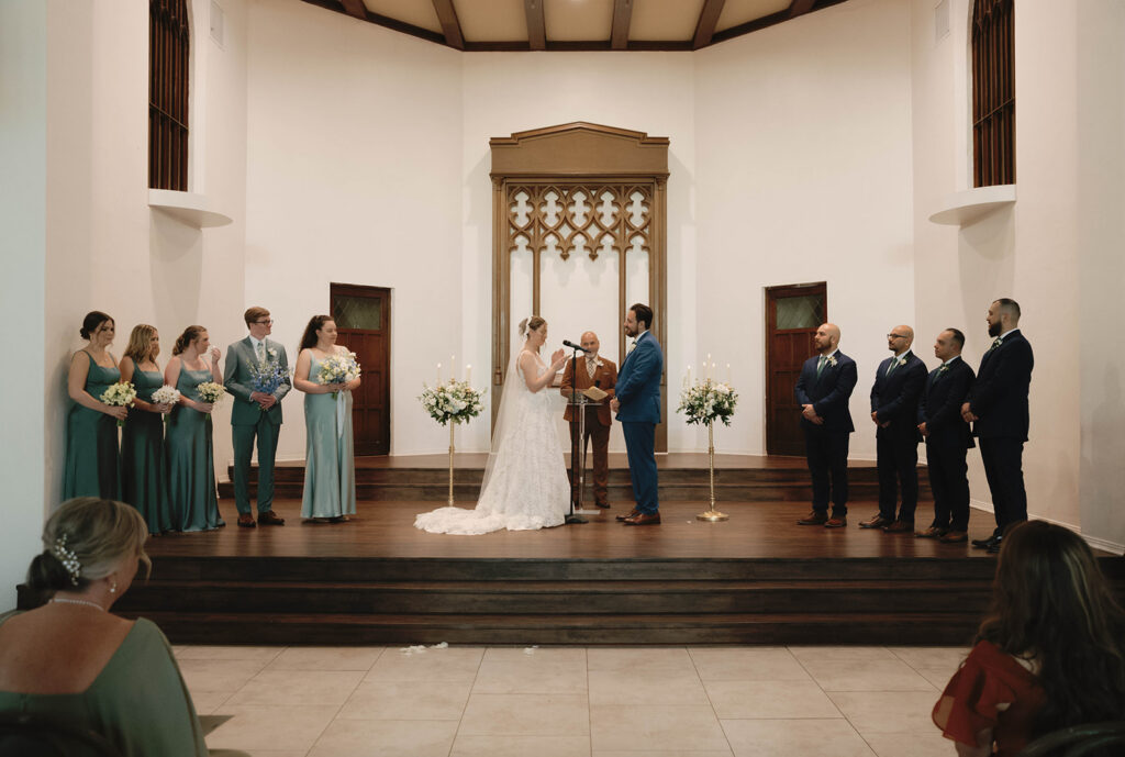 Romantic wedding scene featuring soft pastel florals, elegant decor, emotional couple moments, and guests celebrating in a light-filled venue inspired by Monet’s water lily paintings.