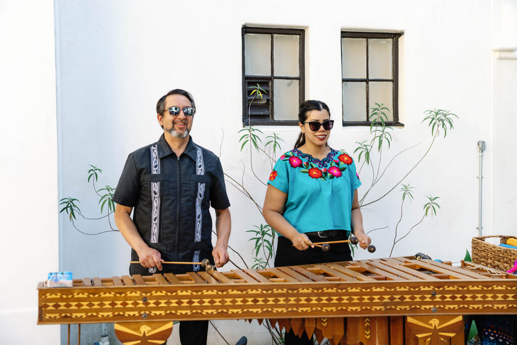 Romantic wedding scene featuring soft pastel florals, elegant decor, emotional couple moments, and guests celebrating in a light-filled venue inspired by Monet’s water lily paintings.