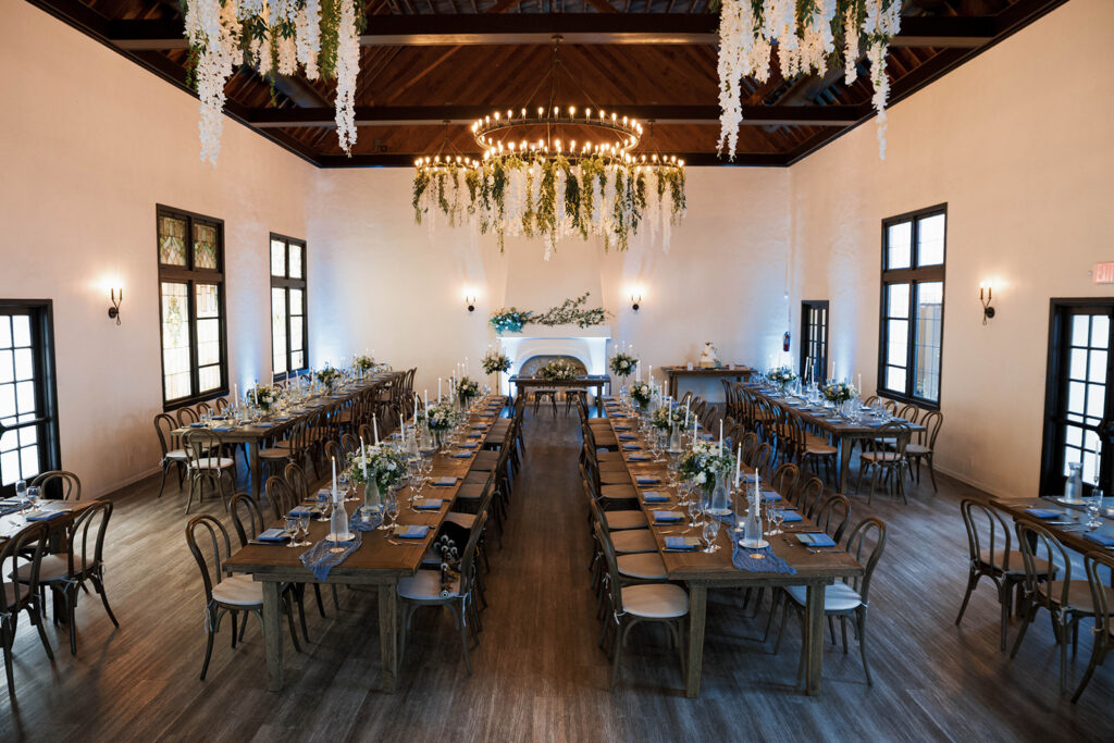 Romantic wedding scene featuring soft pastel florals, elegant decor, emotional couple moments, and guests celebrating in a light-filled venue inspired by Monet’s water lily paintings.