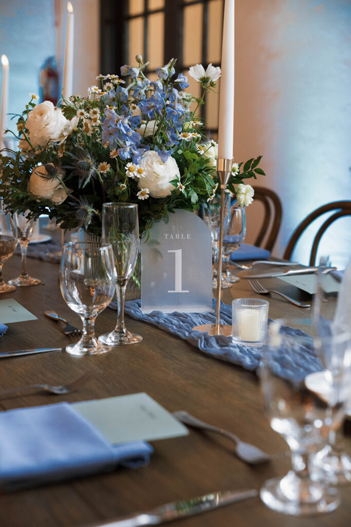 Romantic wedding scene featuring soft pastel florals, elegant decor, emotional couple moments, and guests celebrating in a light-filled venue inspired by Monet’s water lily paintings.