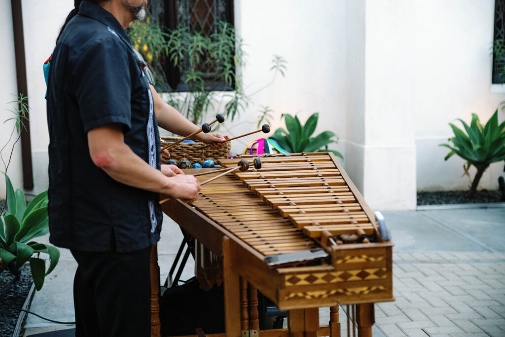 Romantic wedding scene featuring soft pastel florals, elegant decor, emotional couple moments, and guests celebrating in a light-filled venue inspired by Monet’s water lily paintings.