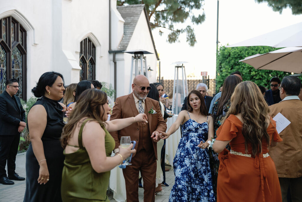 Romantic wedding scene featuring soft pastel florals, elegant decor, emotional couple moments, and guests celebrating in a light-filled venue inspired by Monet’s water lily paintings.