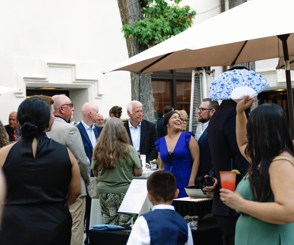 Romantic wedding scene featuring soft pastel florals, elegant decor, emotional couple moments, and guests celebrating in a light-filled venue inspired by Monet’s water lily paintings.