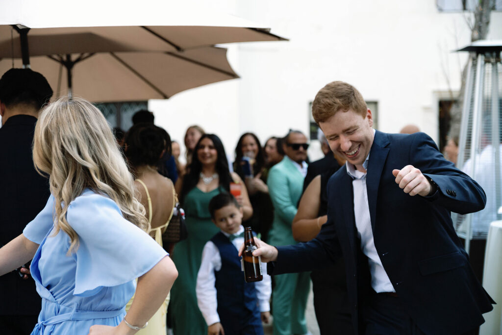 Romantic wedding scene featuring soft pastel florals, elegant decor, emotional couple moments, and guests celebrating in a light-filled venue inspired by Monet’s water lily paintings.
