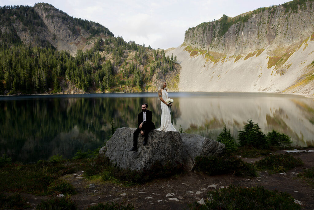 bride dand groom portrait at lake in the north cascades mountains of washington