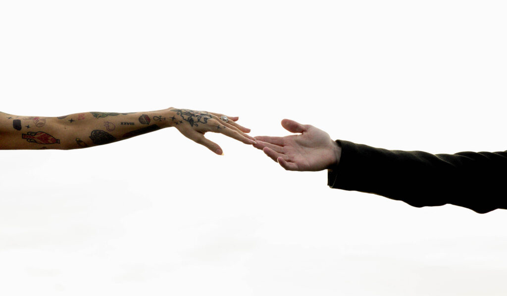bride and groom touching fingers in 